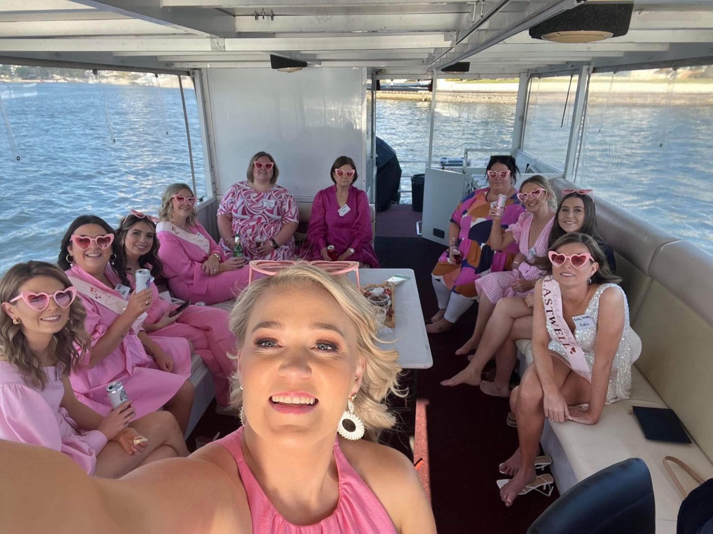 Hens party in heart sunglasses on board